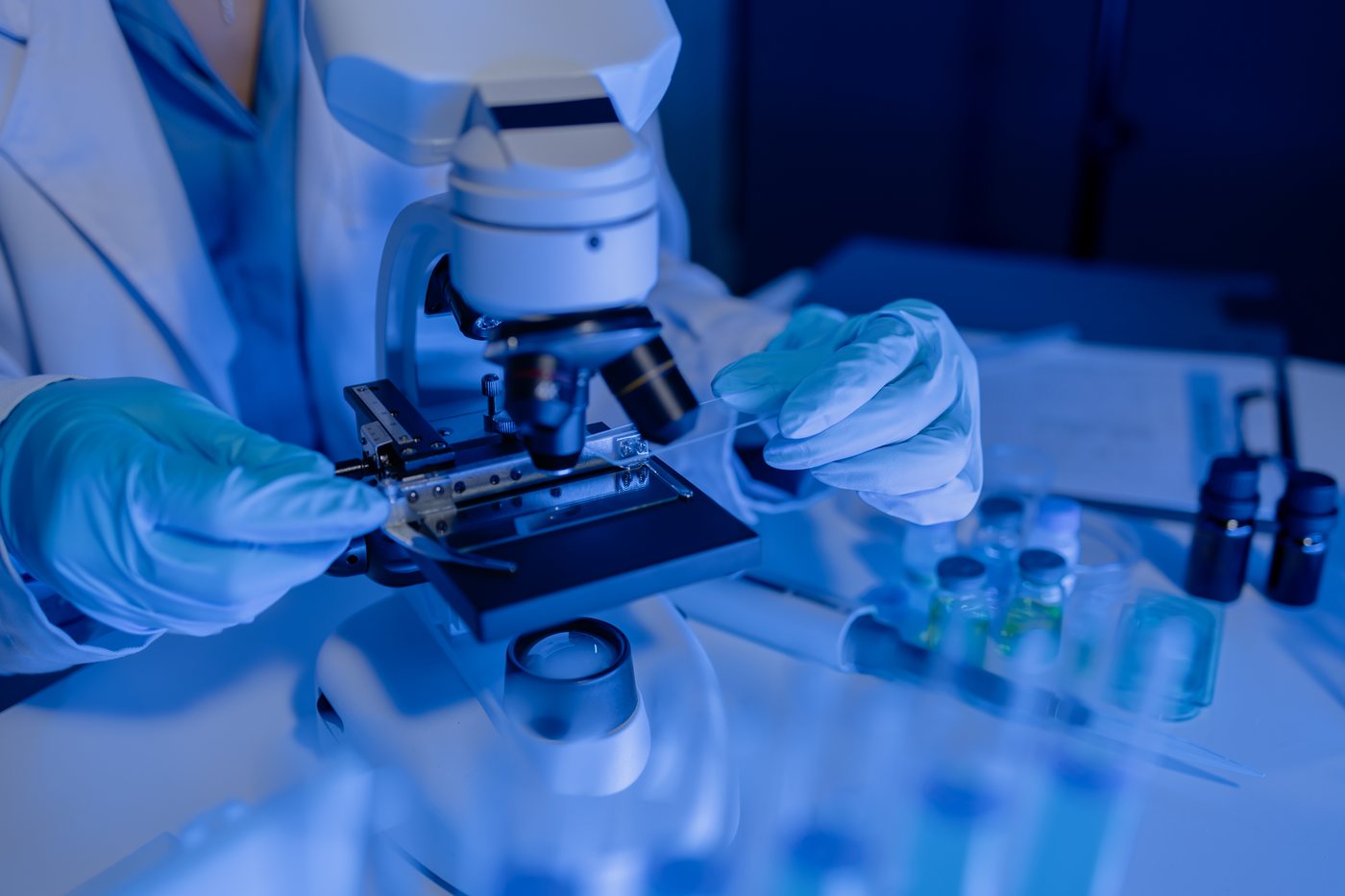 Researcher using a microscope in a laboratory